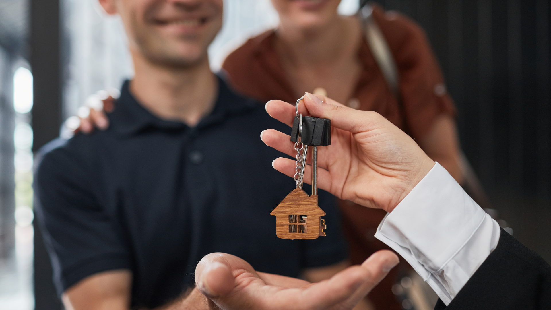 handing keys over to house buyers